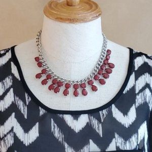 Erica Lyons silvertone with red/maroon jewels
